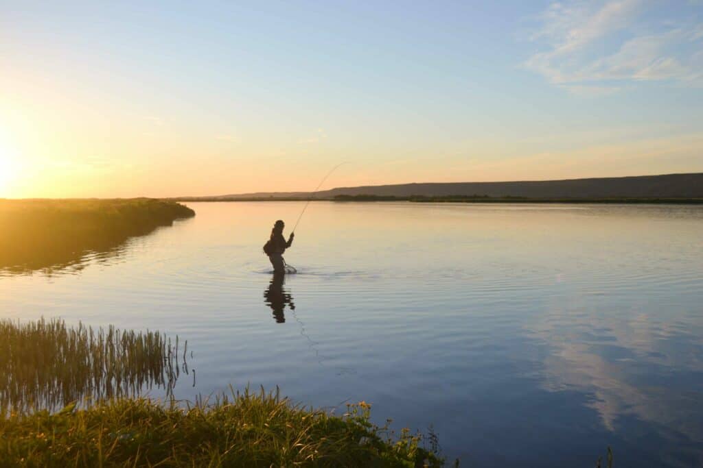 Northern River Fishing fly fisherman in big laxa