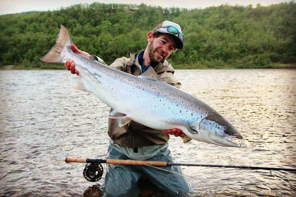 Big fish caught on a fishing trip in a river, showcasing freshwater fishing success.
