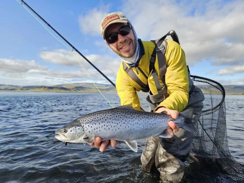 Vibrant fish caught during fishing trip, showcasing successful sport fishing adventure.