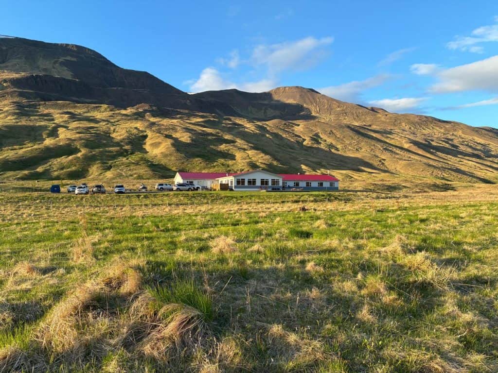 Scenic view of Long Valley Lodge with mountain backdrop and open fields.