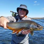 Rainbow trout caught in Iceland, perfect for fishing enthusiasts and outdoor adventure lovers. Fresh caught rainbow trout fishing in Iceland, showcasing high-quality fishing gear and scenic outdoor environment.