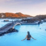 Relaxing geothermal hot spring in Iceland with steaming waters and scenic volcanic backdrop. Natural geothermal hot spring in Iceland, steaming and surrounded by volcanic landscape, perfect for relaxation.